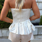 The AK Strapless Flare Top