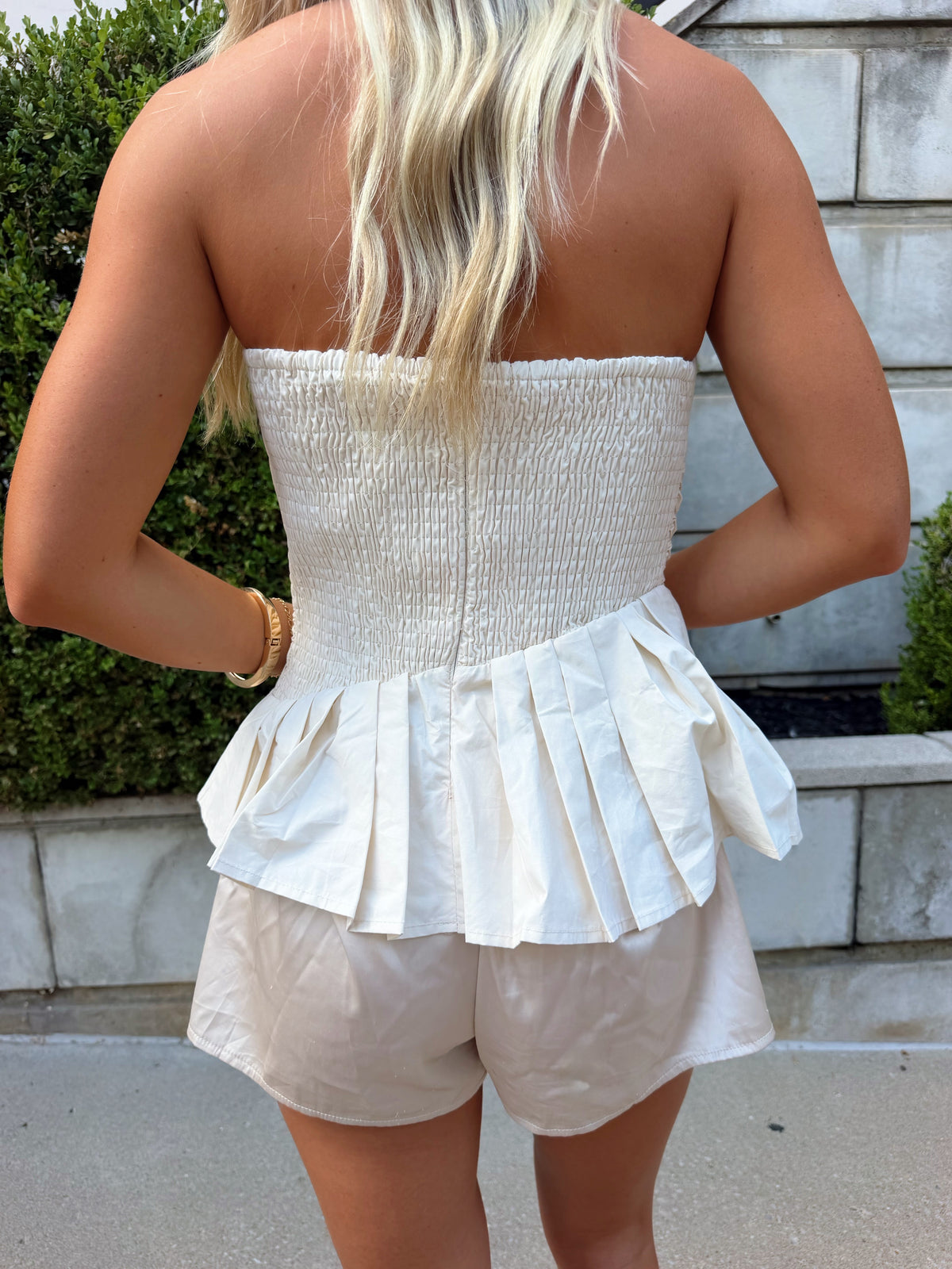 The AK Strapless Flare Top